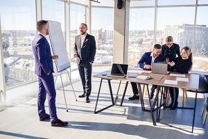 businessman makes a presentation of a new project in the boardroom at a company meeting