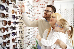 Four,Year,Little,Girl,In,Optics,Store,Choosing,Glasses,With