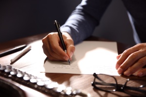 man writing a Annual Notices To Employees