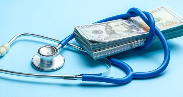 cash dollars and stethoscope