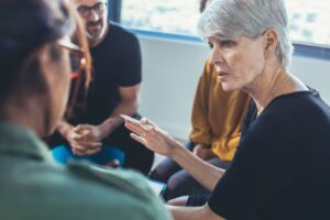 Woman putting forward her ideas in meeting