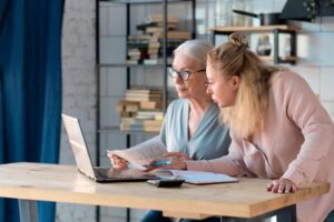 daughter helps her mother with documents