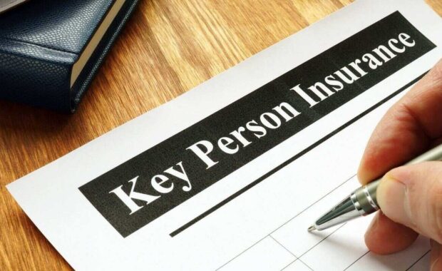 key person Insurance policy agreement on table