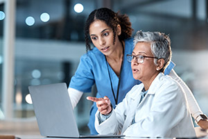 Healthcare workers sitting at a desk