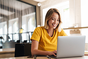 Woman typing on her laptop