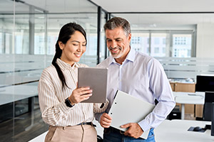 Two employees talking in office