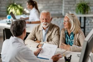 Medical professional talking to patients about Medicare