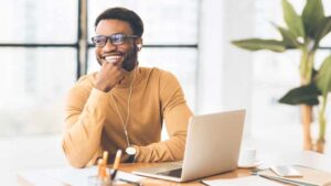 Happy worker on laptop