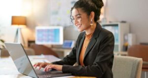 woman smiling on laptop