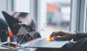 man looking at graphs on computer