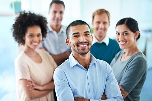 happy employees in a group looking forward