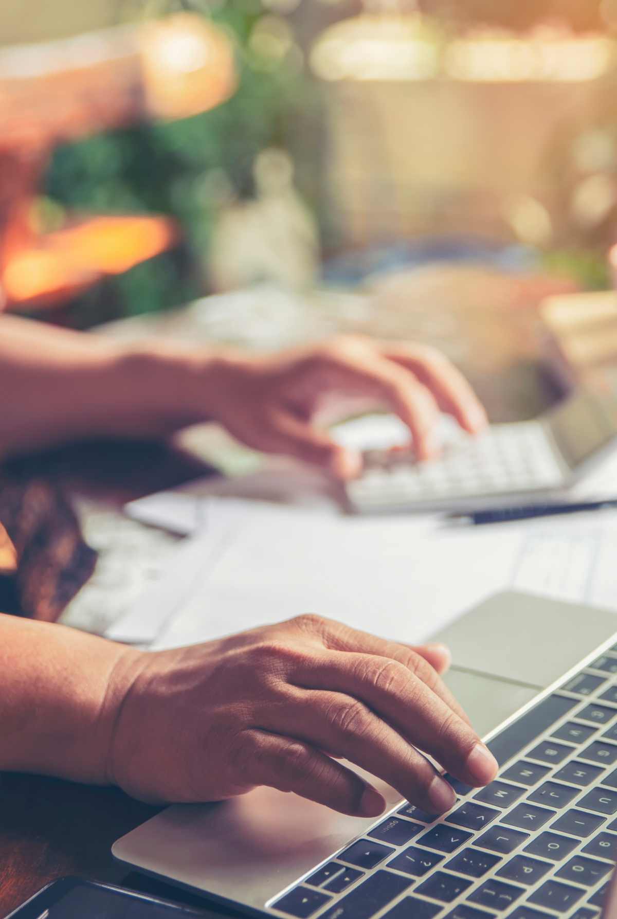 hands on a laptop