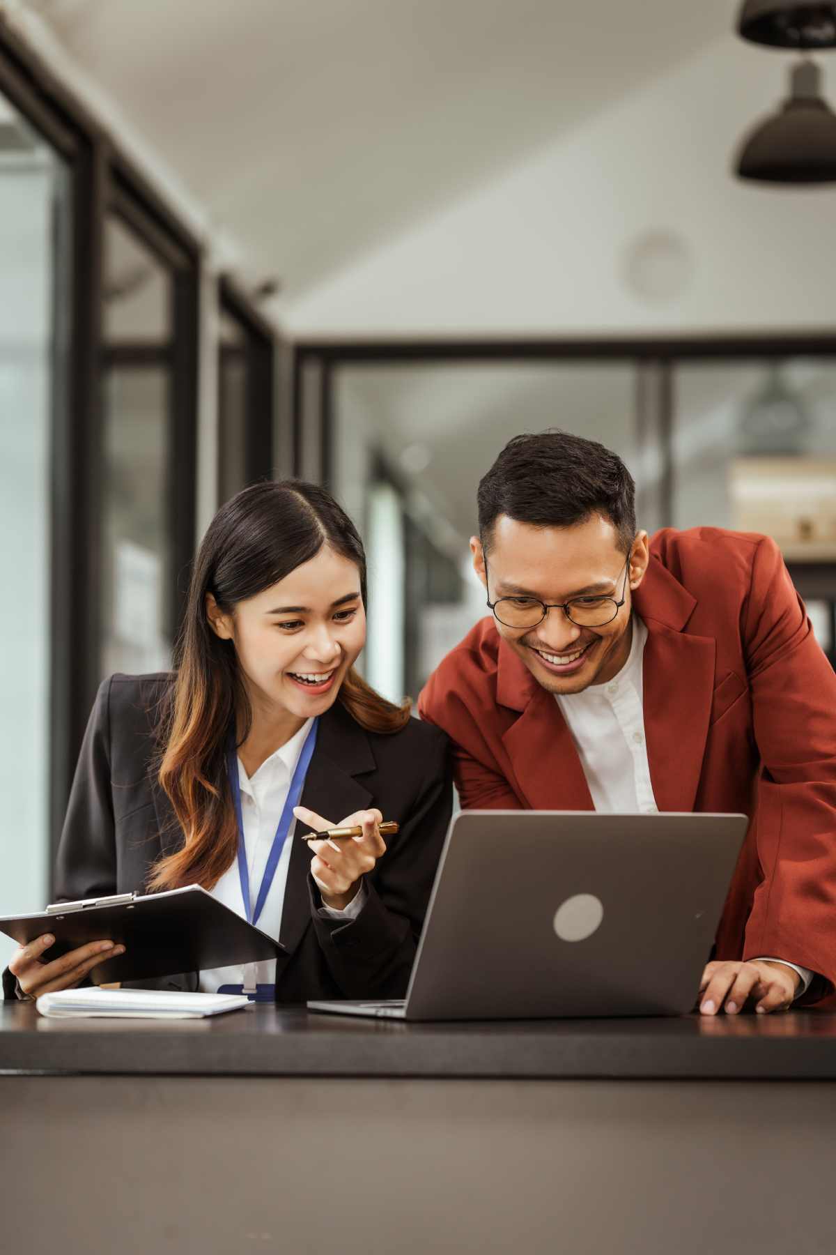 two employees at laptop