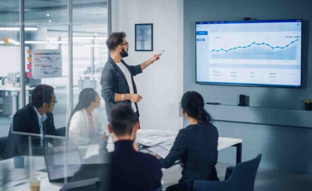 Diverse Modern Office: Motivated Businessman Leads Business Meet