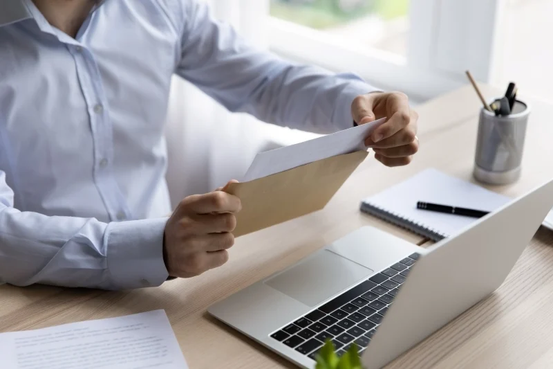 Employee-Opening-Up-Letter-from-Envelope-Mail-800-533