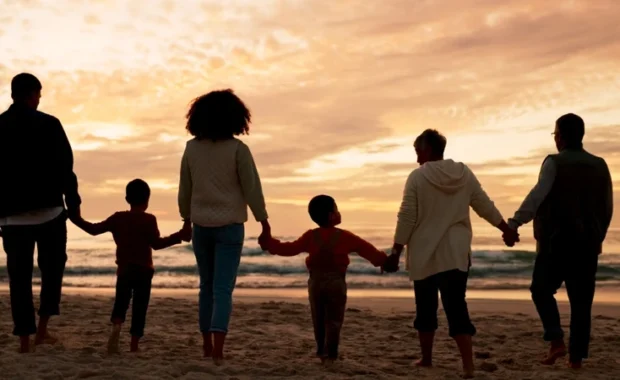 Family-Holding-Hands-Beach-1200-633