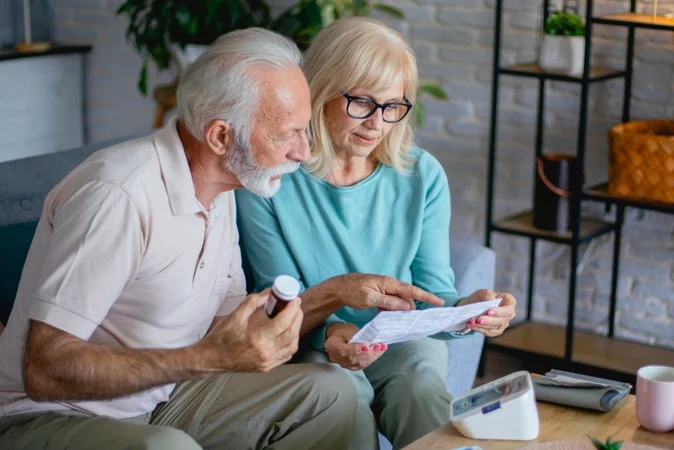 Senior-Couple-Holding-Prescription-1000-667