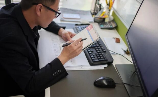 young professional looking through their calendar for opportunities