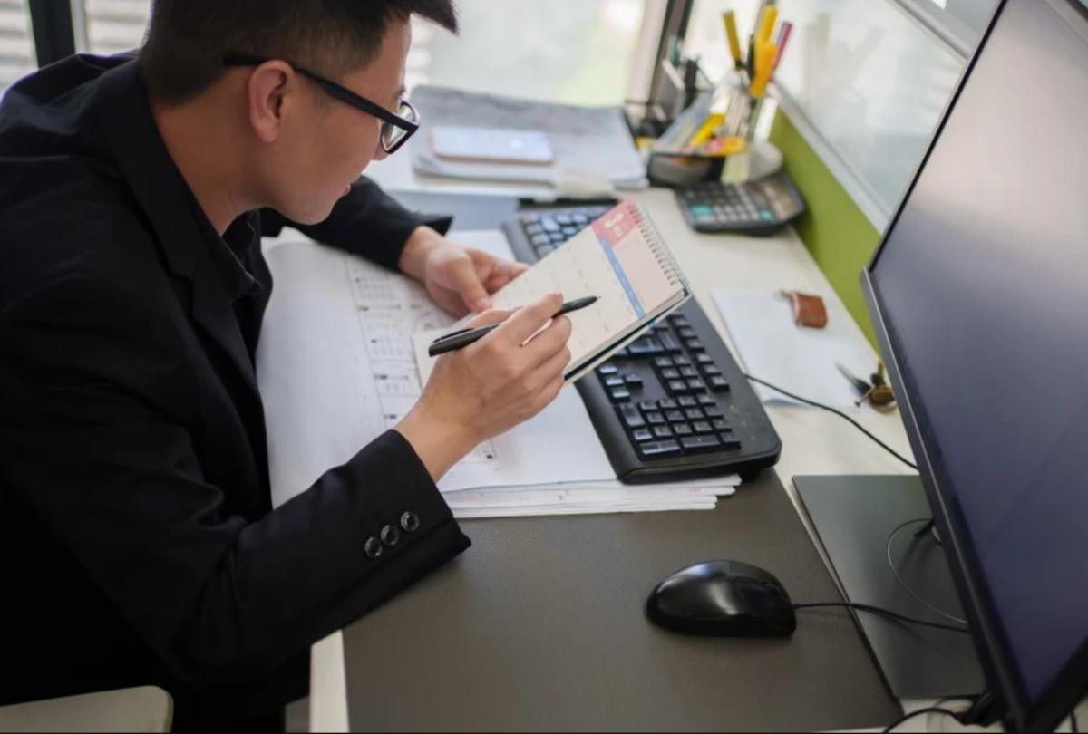 young professional looking through their calendar for opportunities