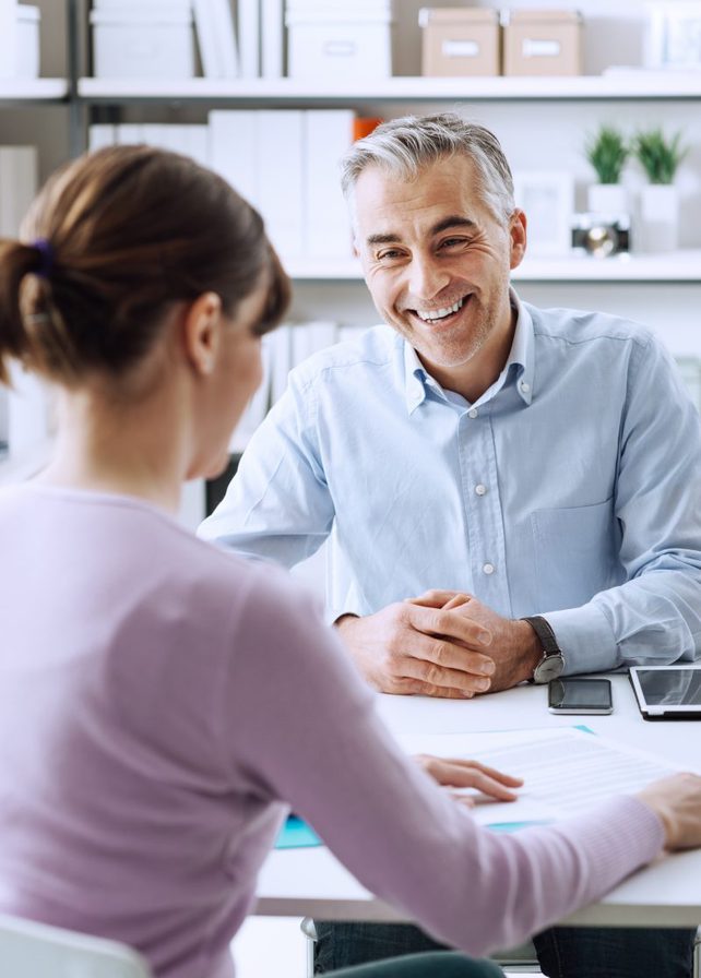 two human resource professionals reviewing their strategies