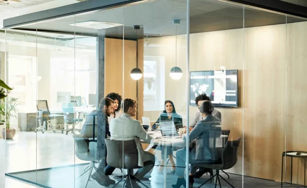 Brown-and-Brown_Business-Colleagues-Discussing-Strategy-At-Office