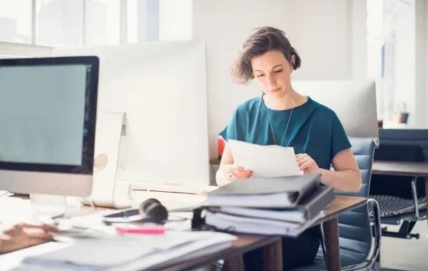 Person-Reviewing-Paperwork-600-400