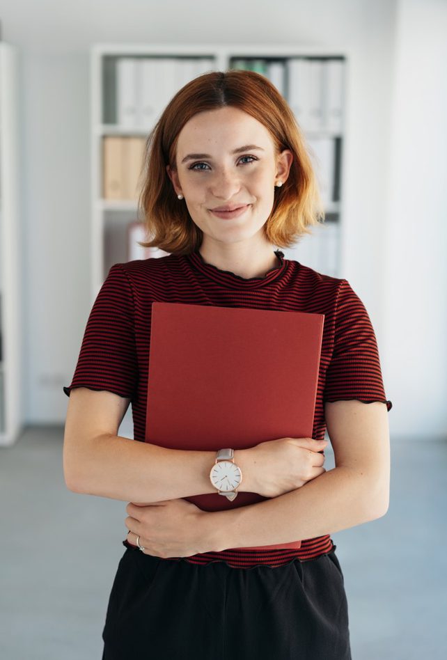 young professional holding their portfolio