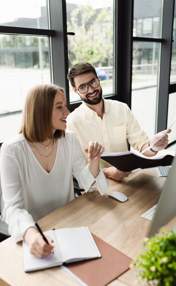 two human resource professionals talking over their schedule