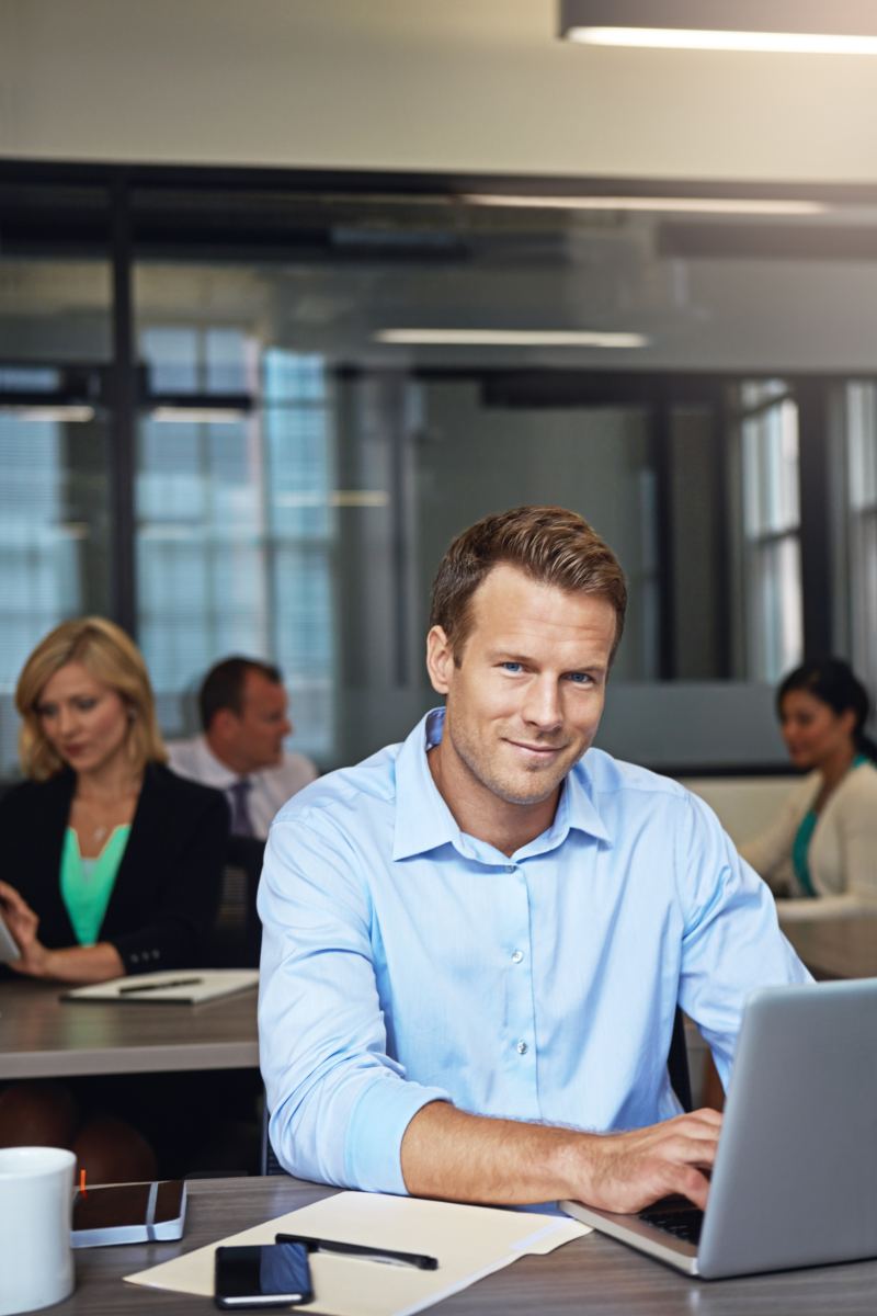 Portrait, happy man or laptop in office for planning, finance management or funding request approval. Coworking, money efficiency or budget analyst with pc to monitor company spending, staff or smile.