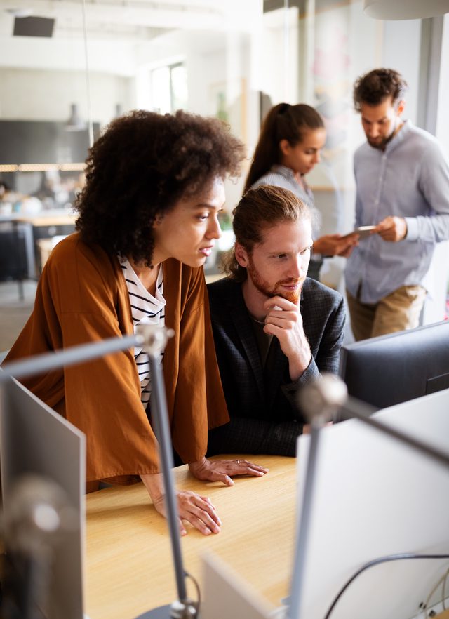 employee benefits managers reviewing strategies